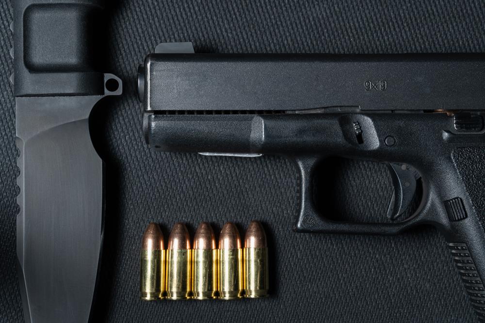 Pistol, 9mm ammo and a fixed blade tactical knife