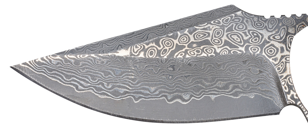 A knife blade with the characteristic wavy and ringed pattern typical of Damascus steel. Isolated background