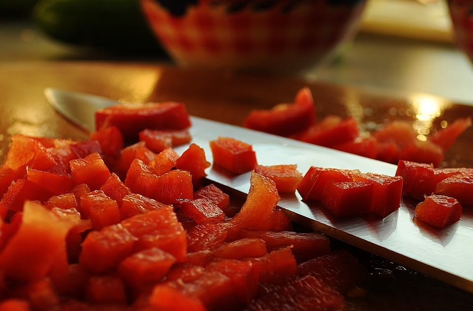 a knife and diced watermelon